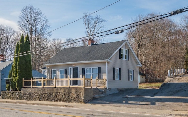 670 Putnam Pike, Rhode Island, RI 02828 - view of front facade featuring a chimney and a shingled roof