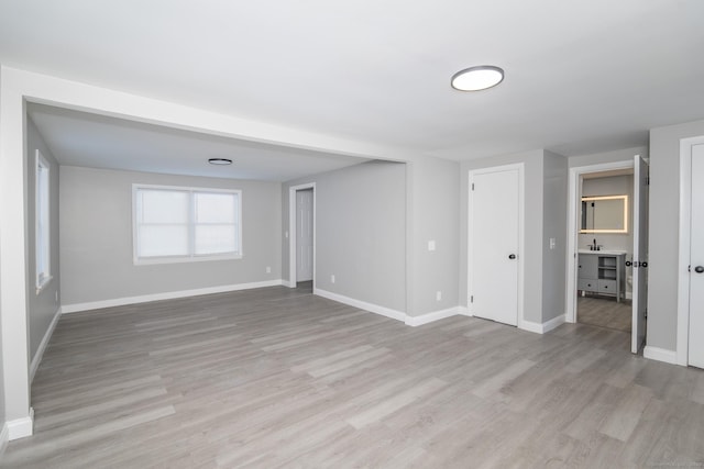 670 Putnam Pike, Rhode Island, RI 02828 - empty room featuring light wood-style flooring and baseboards