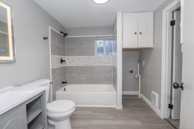 670 Putnam Pike, Rhode Island, RI 02828 - bathroom featuring vanity, toilet, bathing tub / shower combination, and wood finished floors