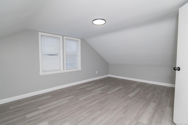 670 Putnam Pike, Rhode Island, RI 02828 - additional living space featuring light wood finished floors, vaulted ceiling, and baseboards