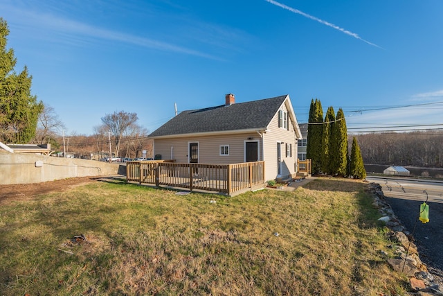 670 Putnam Pike, Rhode Island, RI 02828 - rear view of house featuring a chimney, a lawn, and a deck