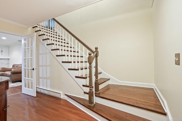 27 E Gate Rd, Danbury, CT 06811 - staircase with baseboard heating, wood finished floors, french doors, crown molding, and baseboards