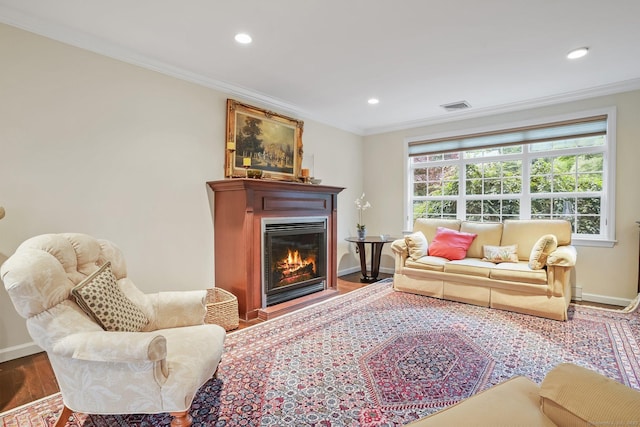 27 E Gate Rd, Danbury, CT 06811 - living area featuring crown molding, wood finished floors, baseboards, a glass covered fireplace, and recessed lighting