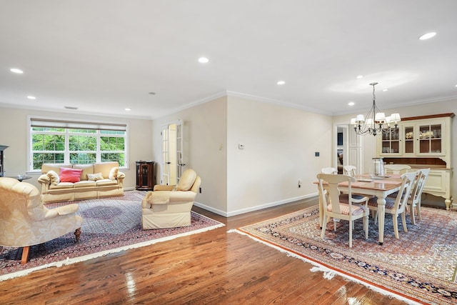 27 E Gate Rd, Danbury, CT 06811 - dining space with wood finished floors, a chandelier, recessed lighting, ornamental molding, and baseboards