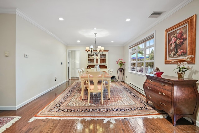 27 E Gate Rd, Danbury, CT 06811 - dining area with wood finished floors, a chandelier, recessed lighting, baseboards, and crown molding