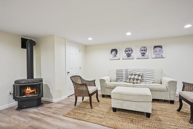 27 E Gate Rd, Danbury, CT 06811 - living room with a wood stove, light wood-style flooring, recessed lighting, and baseboards