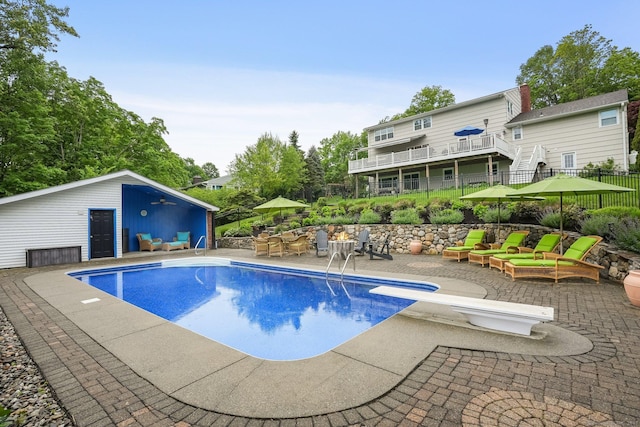 27 E Gate Rd, Danbury, CT 06811 - swimming pool featuring a patio area, a diving board, an outdoor hangout area, and a ceiling fan