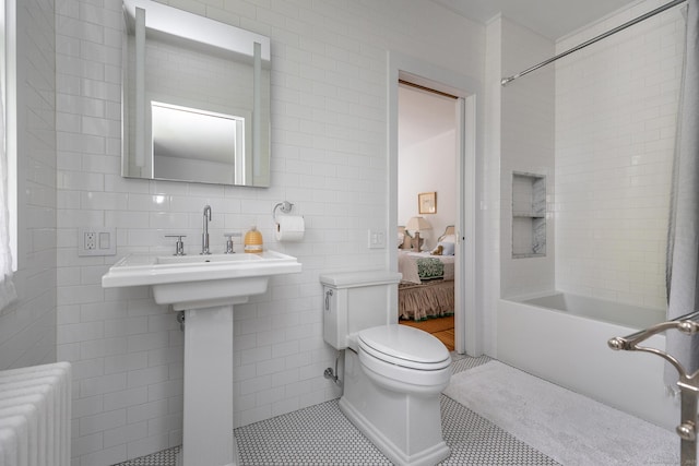 118 S St, Litchfield, CT 06759 - ensuite bathroom featuring radiator heating unit, bathing tub / shower combination, toilet, tile walls, and tile patterned floors