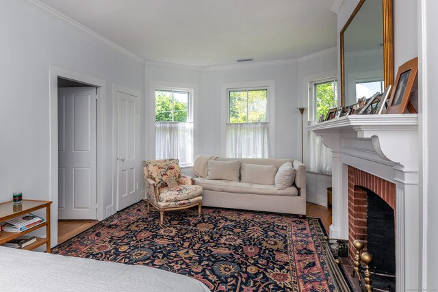 118 S St, Litchfield, CT 06759 - living room with wood finished floors, a brick fireplace, and crown molding