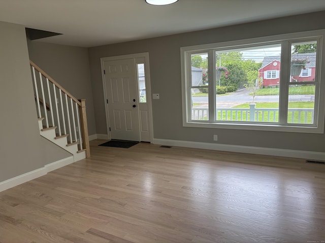 19 Race Ave, Plainville, CT 06062 - foyer entrance featuring stairway, light wood-style flooring, and baseboards