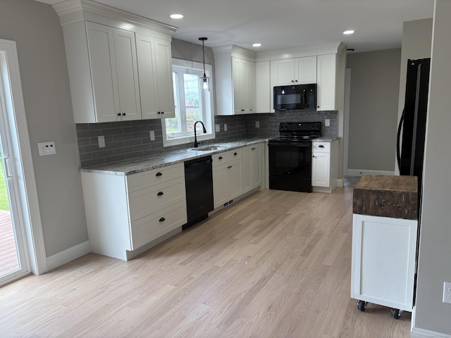 19 Race Ave, Plainville, CT 06062 - kitchen with black appliances, a sink, baseboards, tasteful backsplash, and recessed lighting