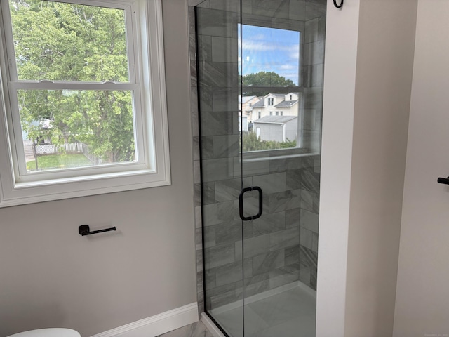 19 Race Ave, Plainville, CT 06062 - bathroom featuring a shower stall, baseboards, and toilet