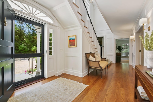 42 Morningside Dr S, Westport, CT 06880 - foyer entrance with stairs, wood finished floors, a decorative wall, and lofted ceiling