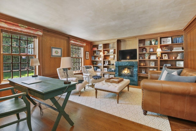 42 Morningside Dr S, Westport, CT 06880 - living room featuring wood finished floors, a premium fireplace, wooden walls, and built in features