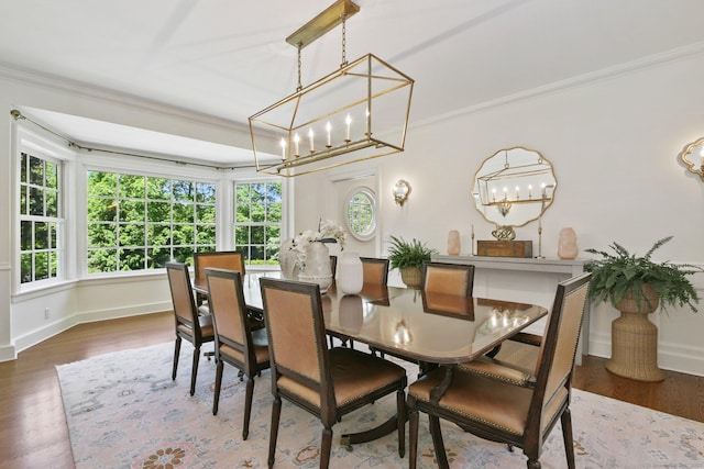 42 Morningside Dr S, Westport, CT 06880 - dining space with a chandelier, ornamental molding, plenty of natural light, wood finished floors, and baseboards