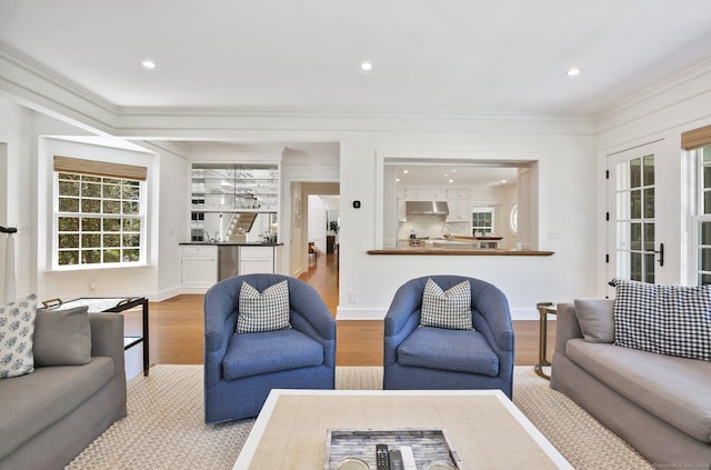 42 Morningside Dr S, Westport, CT 06880 - living room with wood finished floors, crown molding, and recessed lighting