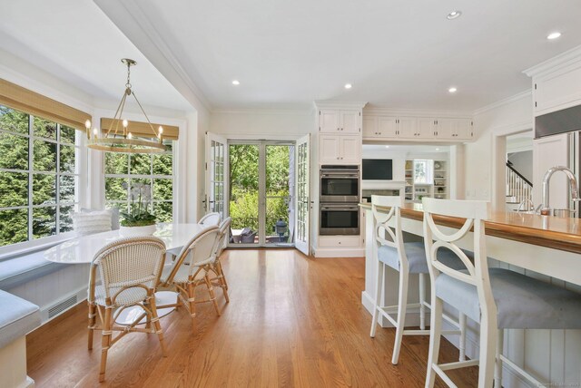 42 Morningside Dr S, Westport, CT 06880 - dining room featuring light wood-style flooring, crown molding, and recessed lighting