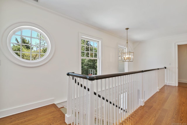 42 Morningside Dr S, Westport, CT 06880 - hall featuring wood finished floors, a chandelier, an upstairs landing, baseboards, and ornamental molding