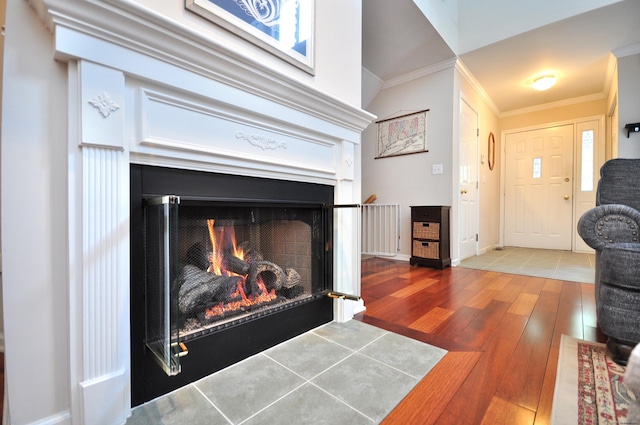 202 Castlewood Dr Unit 202, Bloomfield, CT 06002 - detailed view of a lit fireplace, wood finished floors, and crown molding