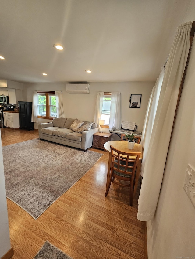16 Walnut St (Pawcatuck), Unit Pawcatuck Stonington, CT 06379 - living area featuring a wall mounted air conditioner, light wood finished floors, and recessed lighting
