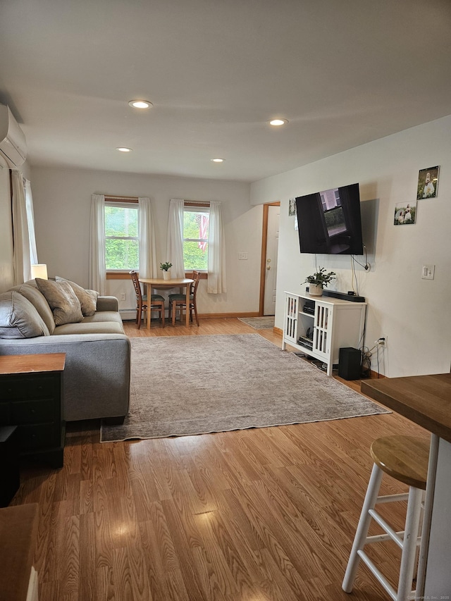 16 Walnut St (Pawcatuck), Unit Pawcatuck Stonington, CT 06379 - living area with a wall unit AC, wood finished floors, and recessed lighting
