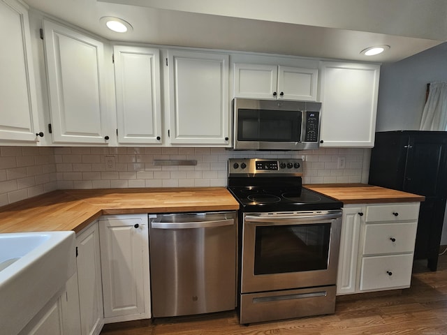 16 Walnut St (Pawcatuck), Unit Pawcatuck Stonington, CT 06379 - kitchen featuring wood counters, appliances with stainless steel finishes, white cabinetry, dark wood finished floors, and recessed lighting