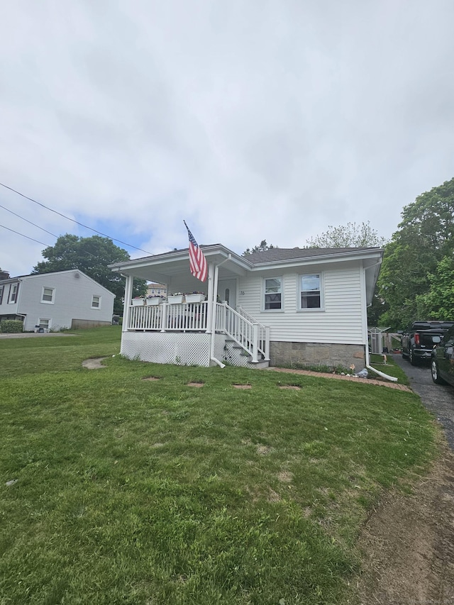 16 Walnut St (Pawcatuck), Unit Pawcatuck Stonington, CT 06379 - view of front of house with a front lawn and a porch
