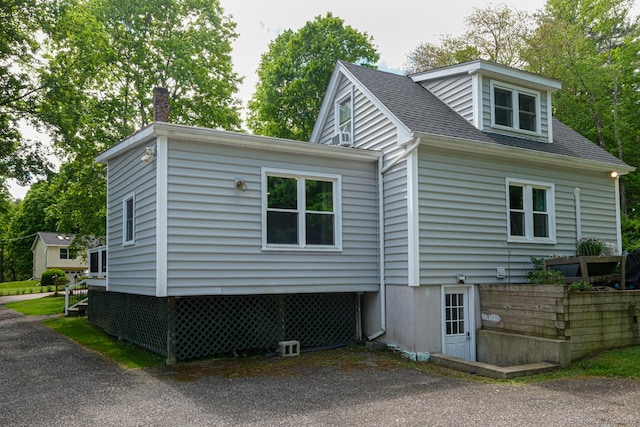 21 Perry St, Salisbury, CT 06039 - view of home's exterior featuring a chimney and a shingled roof