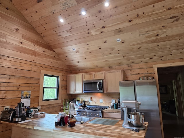 80 John Mack Rd, Hampton, CT 06247 - kitchen featuring appliances with stainless steel finishes, lofted ceiling, wooden walls, wooden ceiling, and a sink