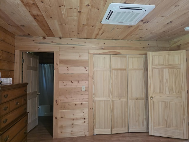80 John Mack Rd, Hampton, CT 06247 - unfurnished bedroom with wood ceiling, wooden walls, wood finished floors, and a wall unit AC