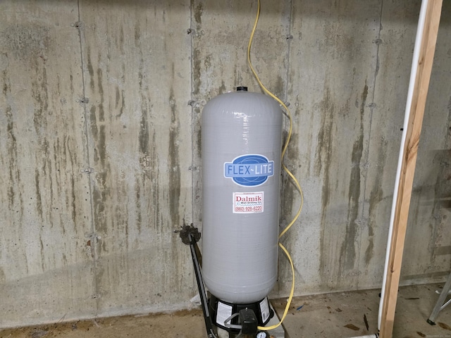 80 John Mack Rd, Hampton, CT 06247 - detailed view of unfinished concrete flooring and a water pressure tank
