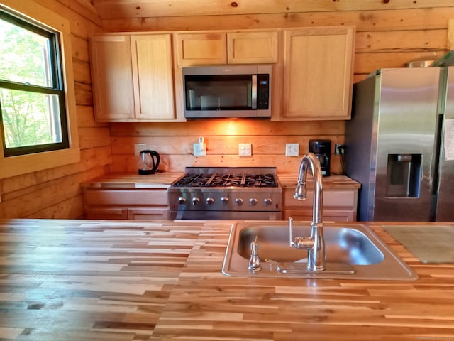 80 John Mack Rd, Hampton, CT 06247 - kitchen featuring stainless steel appliances, a sink, wood counters, light brown cabinets, and wooden walls