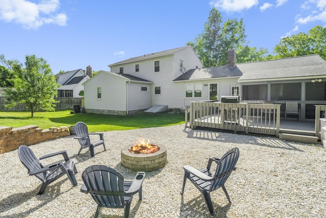 18 Kimberly Dr, Enfield, CT 06082 - rear view of house with a fire pit, a wooden deck, and a chimney