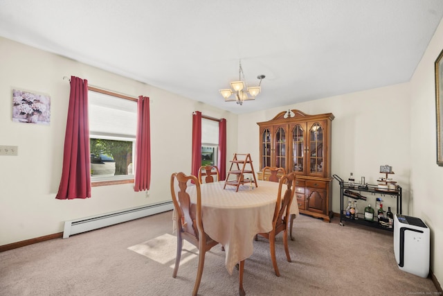 18 Kimberly Dr, Enfield, CT 06082 - carpeted dining area featuring a baseboard radiator, a chandelier, and baseboards