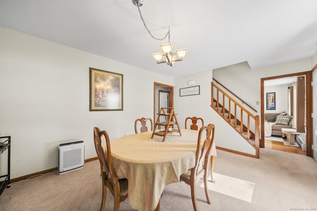 18 Kimberly Dr, Enfield, CT 06082 - carpeted dining area featuring stairs, baseboards, and a chandelier