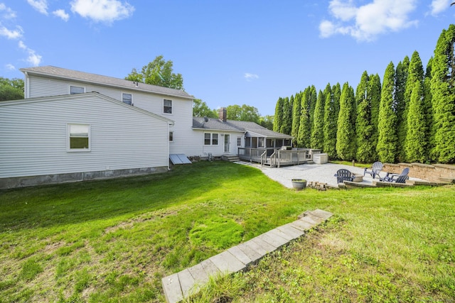 18 Kimberly Dr, Enfield, CT 06082 - view of grassy yard with a wooden deck and a patio