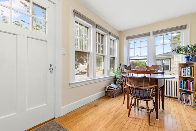 45 Harding Ave, Branford, CT 06405 - dining area with radiator, baseboards, and light wood-style flooring