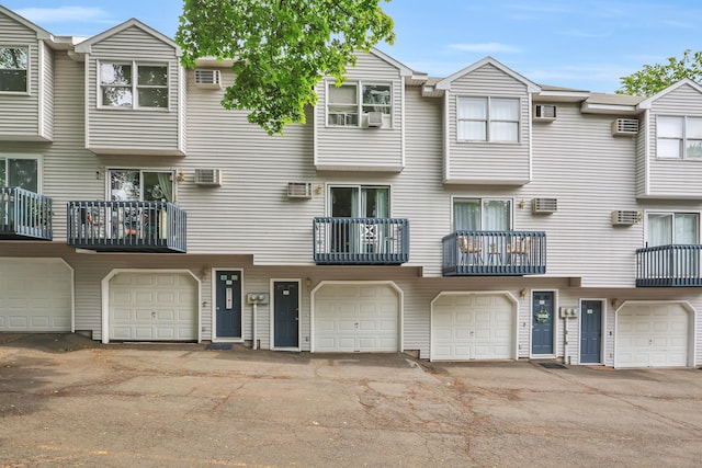 239 Glen St, New Britain, CT 06051 - view of front facade featuring an attached garage and cooling unit