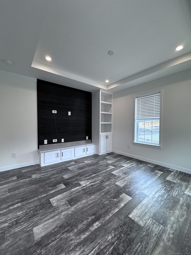 7 Middle Ter, Vernon, CT 06066 - unfurnished living room with a raised ceiling, dark wood-style floors, recessed lighting, and baseboards