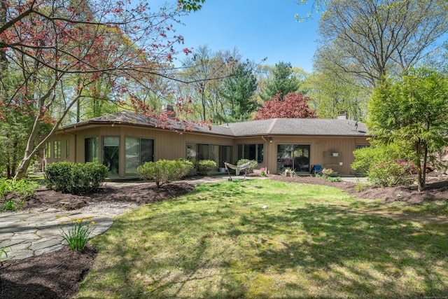 291 Peddlers Rd, Guilford, CT 06437 - rear view of property with a chimney and a lawn