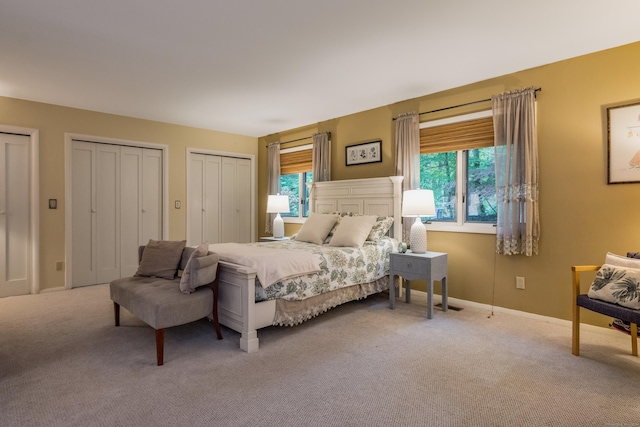291 Peddlers Rd, Guilford, CT 06437 - carpeted bedroom with two closets and baseboards