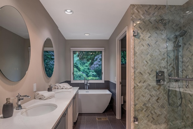 291 Peddlers Rd, Guilford, CT 06437 - full bathroom featuring double vanity, a shower stall, a freestanding bath, tile walls, and toilet