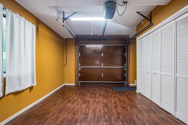 291 Peddlers Rd, Guilford, CT 06437 - garage with a garage door opener and baseboards
