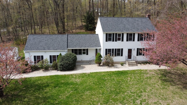 65 County Rd, Southington, CT 06444 - view of front facade featuring a chimney, a front yard, a shingled roof, and a forest view