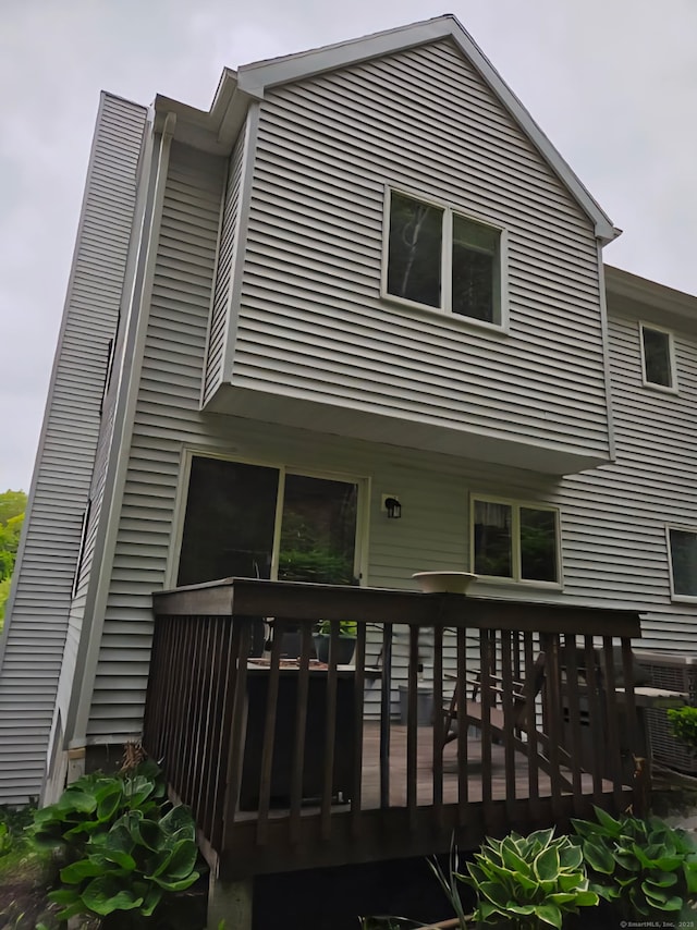 605 Whetstone Mls Unit 605, Killingly, CT 06241 - back of property with a wooden deck