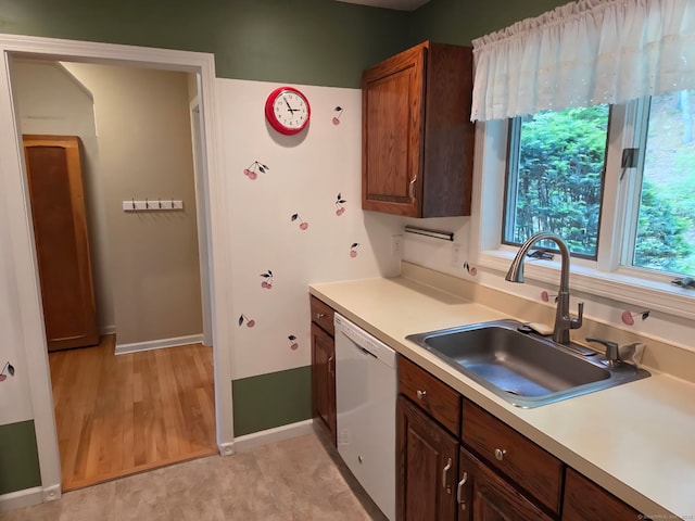605 Whetstone Mls Unit 605, Killingly, CT 06241 - kitchen featuring a sink, dishwasher, baseboards, and light countertops
