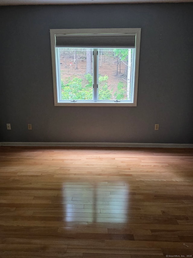 605 Whetstone Mls Unit 605, Killingly, CT 06241 - spare room with wood finished floors and baseboards