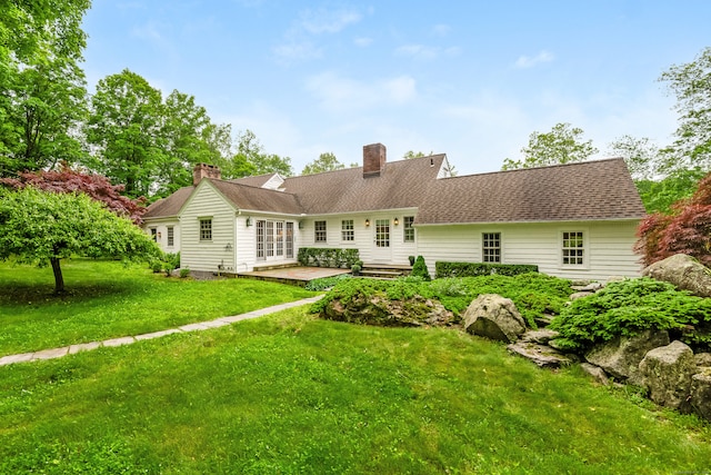 1208 Smith Ridge Rd, New Canaan, CT 06840 - rear view of property featuring a yard, a patio area, and french doors
