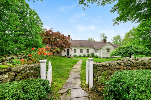 1208 Smith Ridge Rd, New Canaan, CT 06840 - view of front of house with a front lawn and a chimney