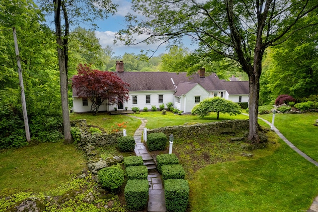 1208 Smith Ridge Rd, New Canaan, CT 06840 - view of front of home with a chimney and a front lawn